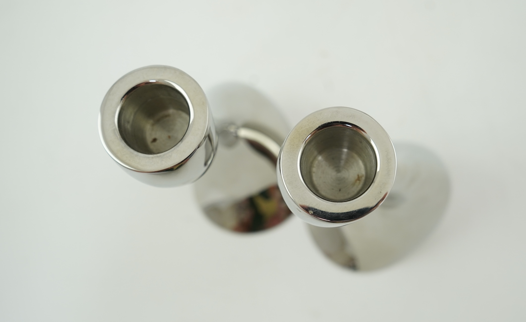 Constantin Wortmann for Georg Jensen: A pair 'of Cobra' polished steel candlesticks, marked 